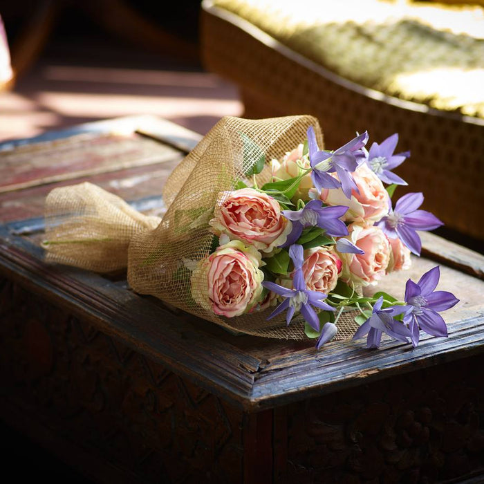 Artificial flower bouquet with pink roses and blue clematis